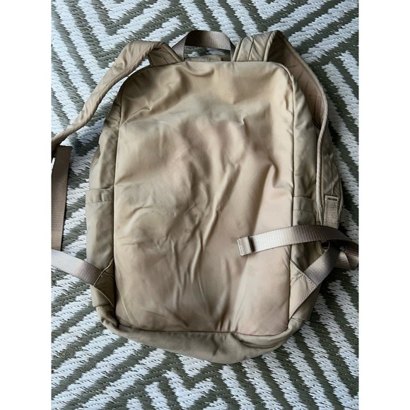 lululemon backpack beige 2-in-1 Convertible 21L With An Internal Laptop Sleeve And Side Water Bottle Pockets Tan Lululemon Backpack